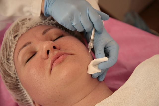 A beautiful woman getting her face a treatment to sooth and calm skin.